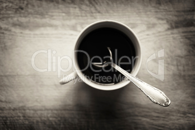 Horizontal cup with spoon bokeh background