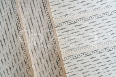 Diagonal vintage punched card textured background