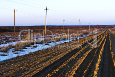 Russian countryside offroad with power lines background