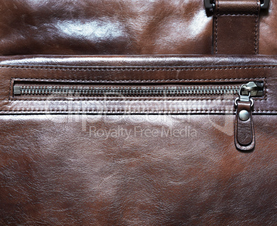 Horizontal brown leather case with zipper background