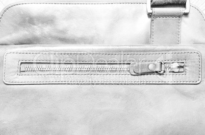 Horizontal bleached pale leather case with zipper background