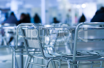 Horizontal empty cafe table with chairs bokeh background