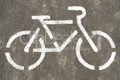 Bicycle symbol on textured asphalt background