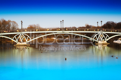 Horizontal dramatic arc bridge in Moscow park background