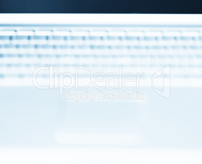 Horizontal laptop keyboard bokeh background