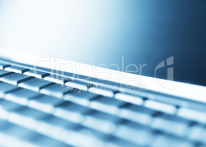 Diagonal perspective laptop keyboard bokeh background