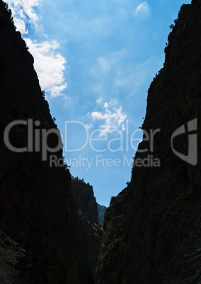 Vertical mountain crack sky cloudscape background backdrop