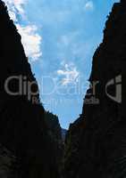 Vertical mountain crack sky cloudscape background backdrop