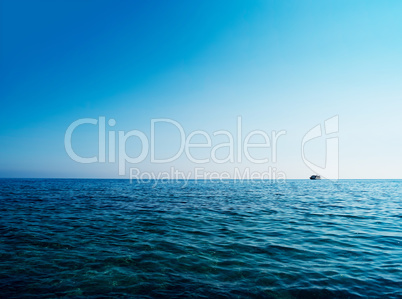 Horizontal blue ocean ship on horizon background