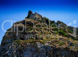 Horizontal vivid abandoned castle on the rock hill landscape bac