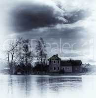 Vertical vintage vibrant blue sepia house on waters background b