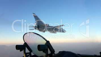 Military jet bomber Su-24 Fencer flying above the clouds.