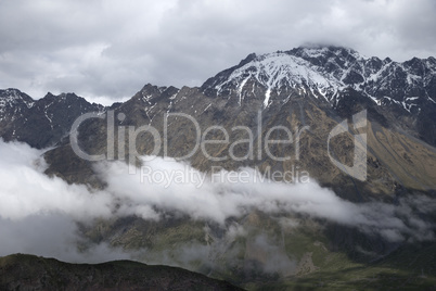 Clouds Flying Between Mountains