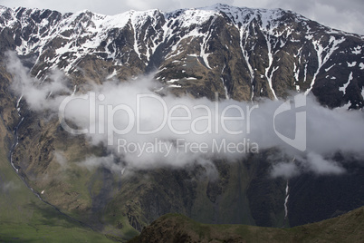 Clouds Flying Between Mountains