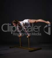 Beautiful acrobat training on circus stands