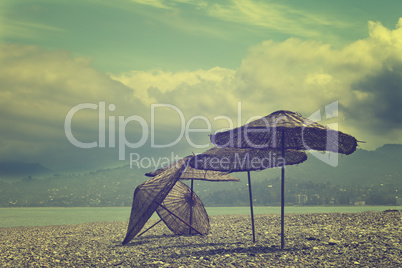 Old sunshade on deserted beach