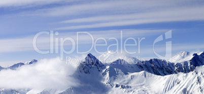 Panoramic view on high mountains in haze