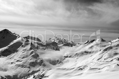 Black and white snowy mountains in evening