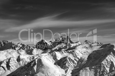 Black and white Caucasus Mountains in wind evening
