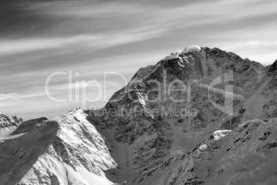 Black and white winter mountains at sun morning