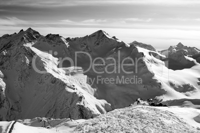 Black and white Snowy off-piste slopes at evening