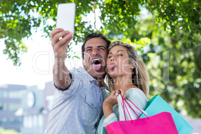 Couple making face while taking selfie