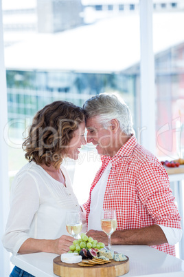 Romantic couple standing at restaurant