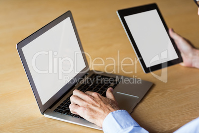 Cropped image of man working on laptop