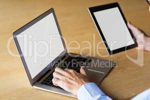 Cropped image of man working on laptop