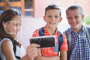 Schoolkids taking selfie from mobile phone