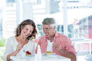 Couple enjoying food at restaurant