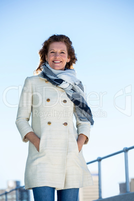 Portrait of happy woman standing