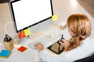 Creative businesswoman working at computer desk