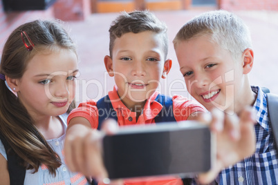 Schoolkids taking selfie from mobile phone