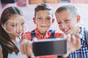 Schoolkids taking selfie from mobile phone