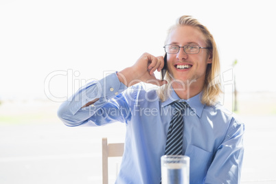 Happy man talking on mobile phone