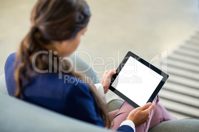 Woman using digital tablet