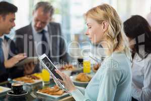 Woman using digital tablet