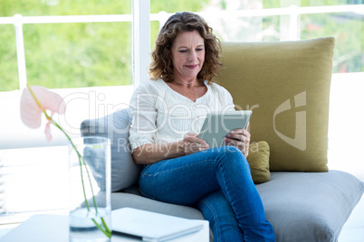 Mature woman using tablet