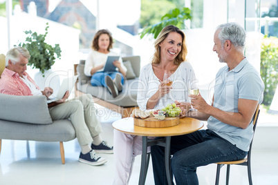 Mature couple having wine in restaurant