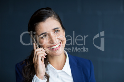 Smiling woman talking on phone