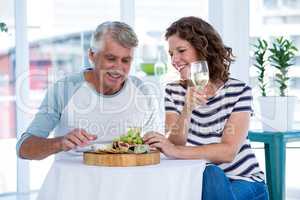 Mature couple sitting at restaurant