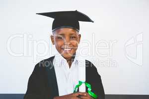 Portrait of schoolkid pretending to be graduate