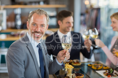 Portrait of businessman having lunch which his colleagues