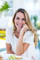 Portrait of beautiful woman at table in restaurant