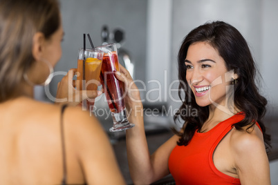 Two beautiful women having cocktail