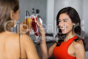 Two beautiful women having cocktail