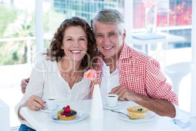 Portrait of happy couple at restaurant