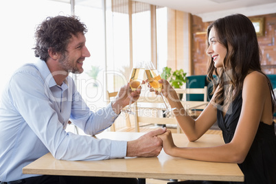 Couple toasting glasses of champagne