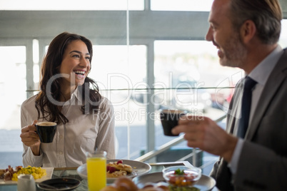 Business people having meal in restaurant